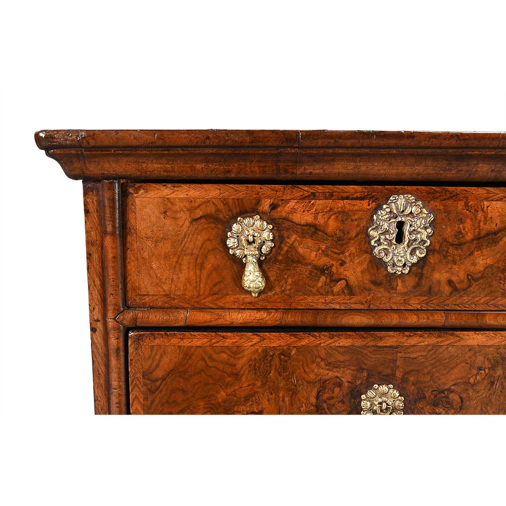A George I Period Chest Veneered in Highly Figured Walnut