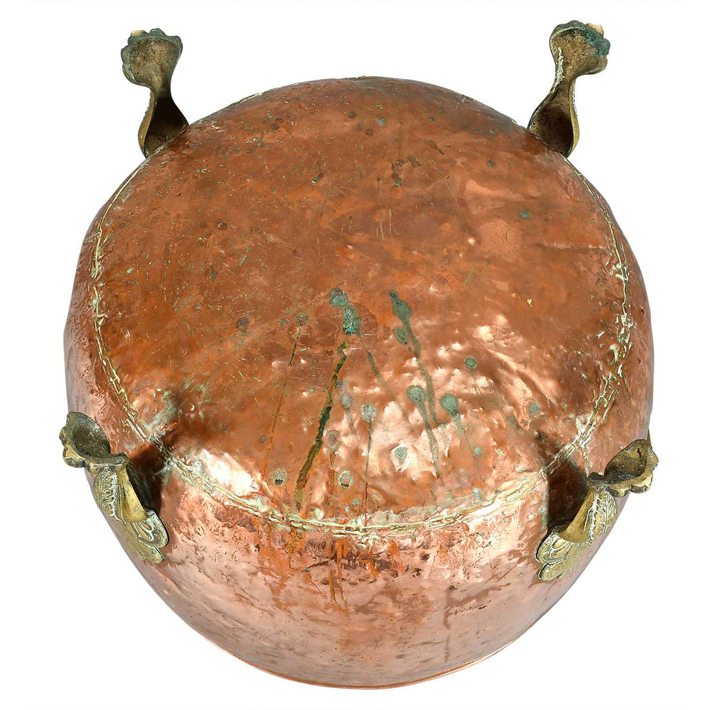 A Large Circular Copper Bin on Brass Paw Feet