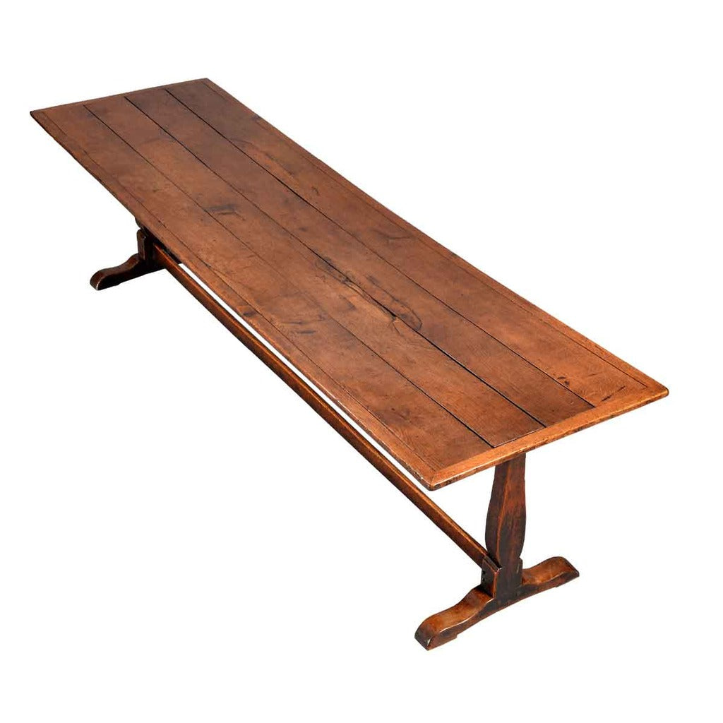 An early 18th Century farm table on trestle base. View 2