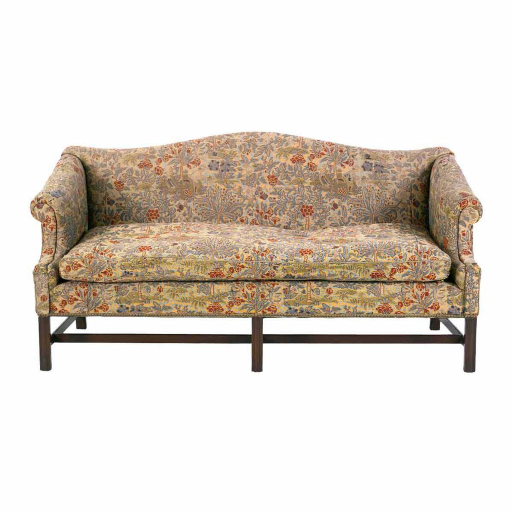 A 19th century George III period sofa of camelback form with rolled arms. view 2