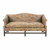 A 19th century George III period sofa of camelback form with rolled arms. view 2