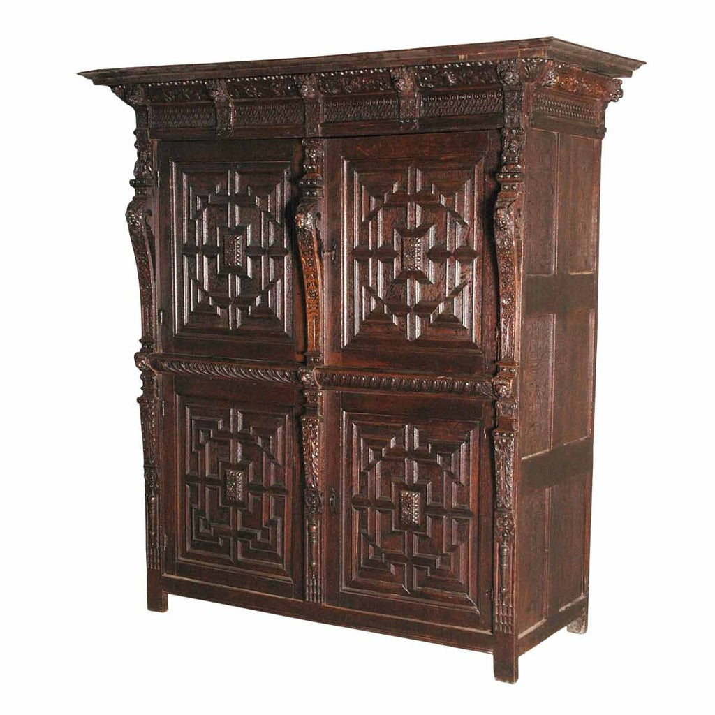 A 17th century oak Flemish guild cupboard. view 1
