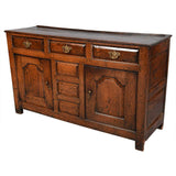 A Queen Anne Period Oak Dresser with Three Drawers over Two Cupboards