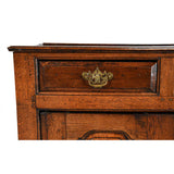 A Queen Anne Period Oak Dresser with Three Drawers over Two Cupboards