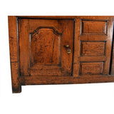 A Queen Anne Period Oak Dresser with Three Drawers over Two Cupboards