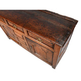 A Queen Anne Period Oak Dresser with Three Drawers over Two Cupboards