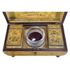 A Regency Period Penwork Tea Caddy with Unusual Ground Color