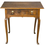 An antique 18th century English oak side table with a single drawer. view 2