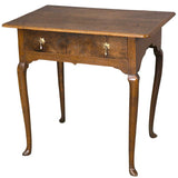 An antique 18th century English oak side table with a single drawer. view 1