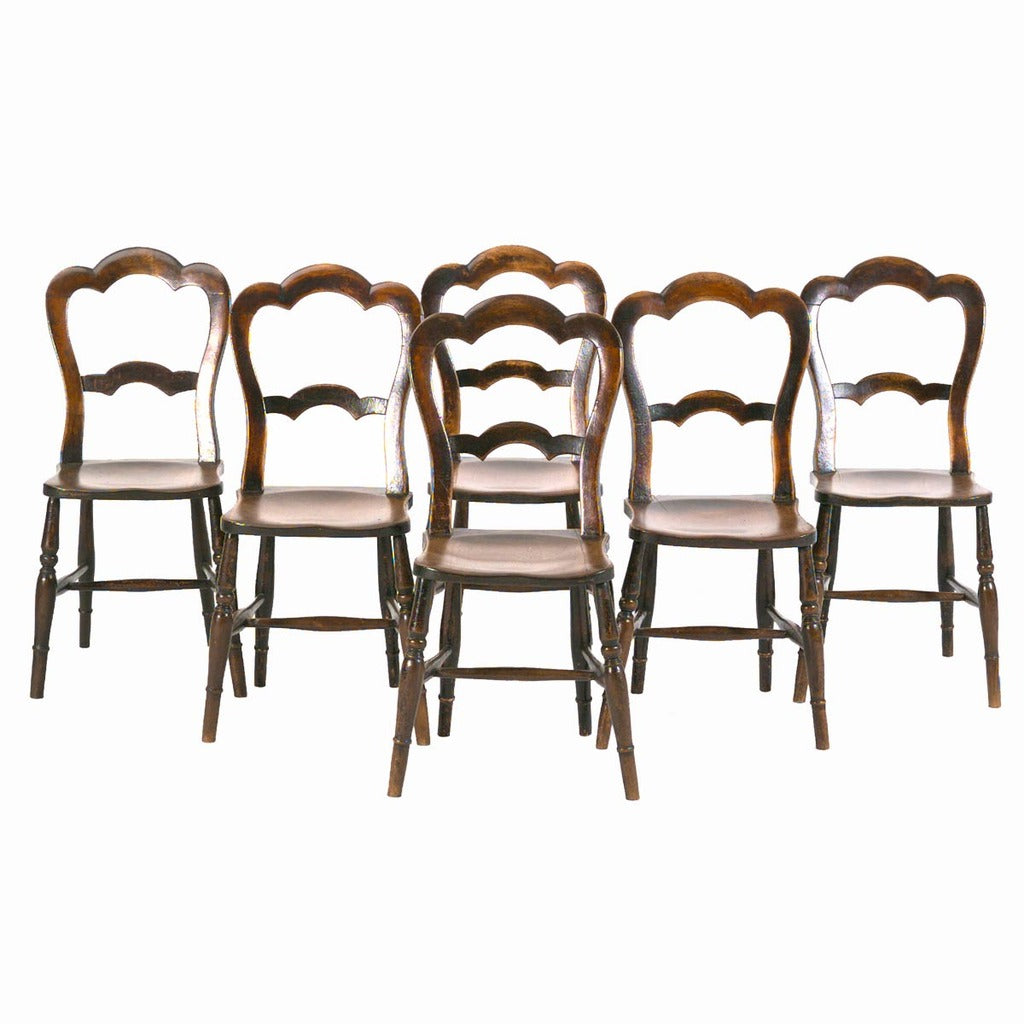 A set of six English country side chairs with shaped crest rail and cross splat. view 1
