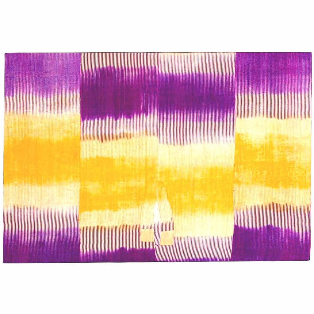 An Uzbek ikat in silk with striking purple and gold pattern from 19th century. view 1