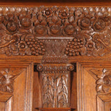 A highly carved 19th century oak armoire. view 3