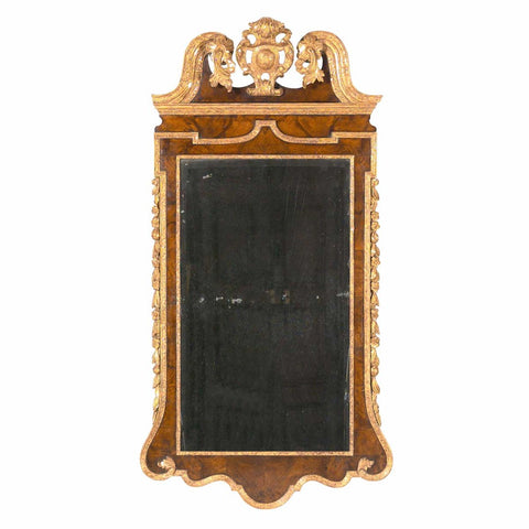 A large antique George III walnut and parcel gilt mirror with the original plate. view 1
