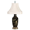 A 19th century Chinese mirror black vase with baluster shape, gold decoration, brass mounts, and silk shade. view 1
