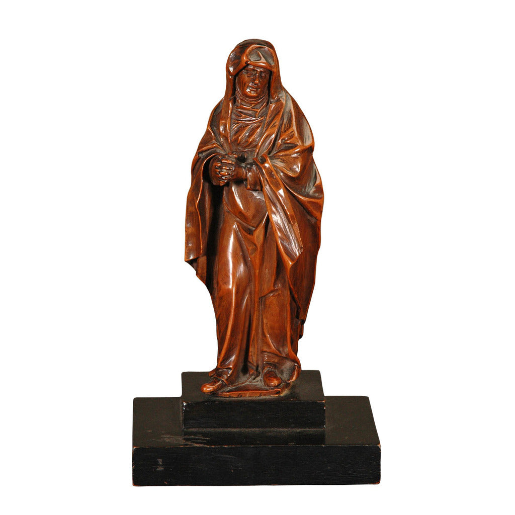 A 17th century Flemish boxwood carving of a robed figure. view 1