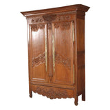 A highly carved 19th century oak armoire. view 1
