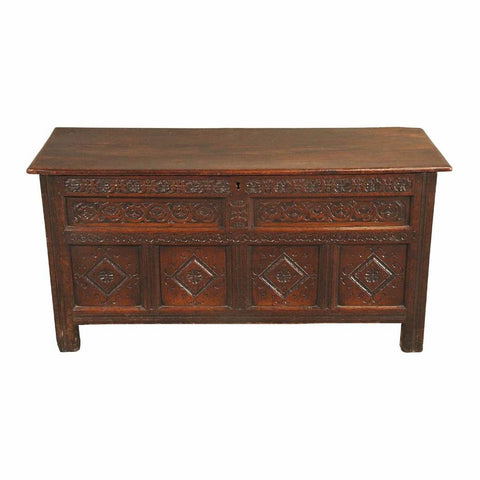 A 18th century highly carved oak coffer. view 1