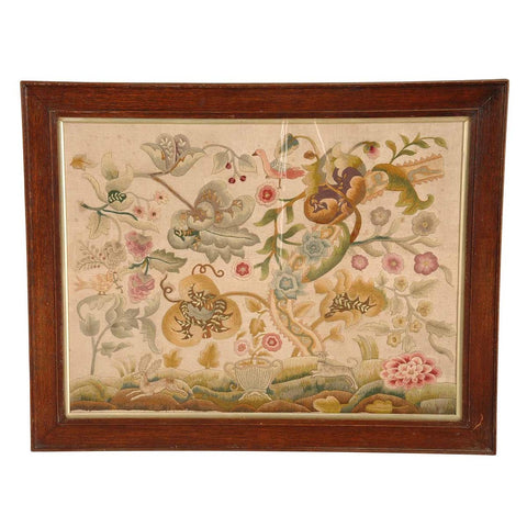An 19th Century antique English crewel work panel in an oak frame. View 1