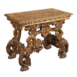 An Italian boldly carved giltwood console with C-scroll legs and painted faux-marble top. View 2