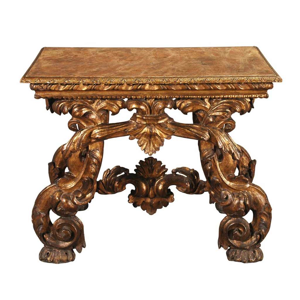 An Italian boldly carved giltwood console with C-scroll legs and painted faux-marble top. View 1