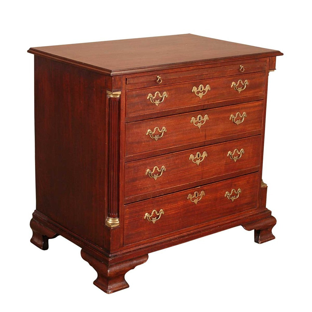 A 18th century Chippendale period mahogany chest of drawers with a brushing slide. view 1