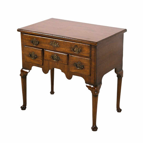 An English mahogany lowboy standing on modified cabriole legs ending in pad feet. view 1