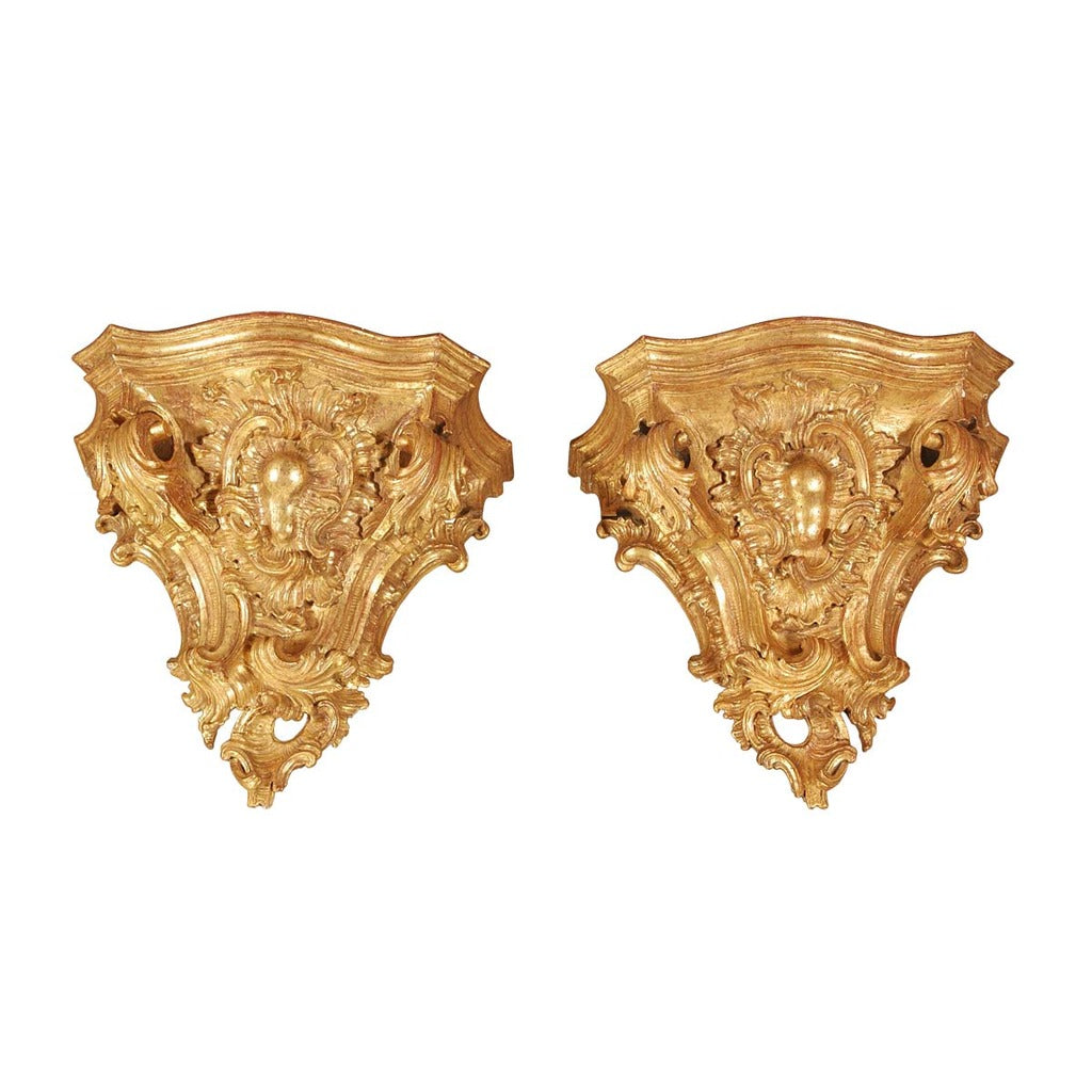 A pair of massive Italian gilt brackets from the 18th century. view 1
