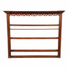 An English oak hanging rack with fluted columns and open fretwork just below the cornice. view 1