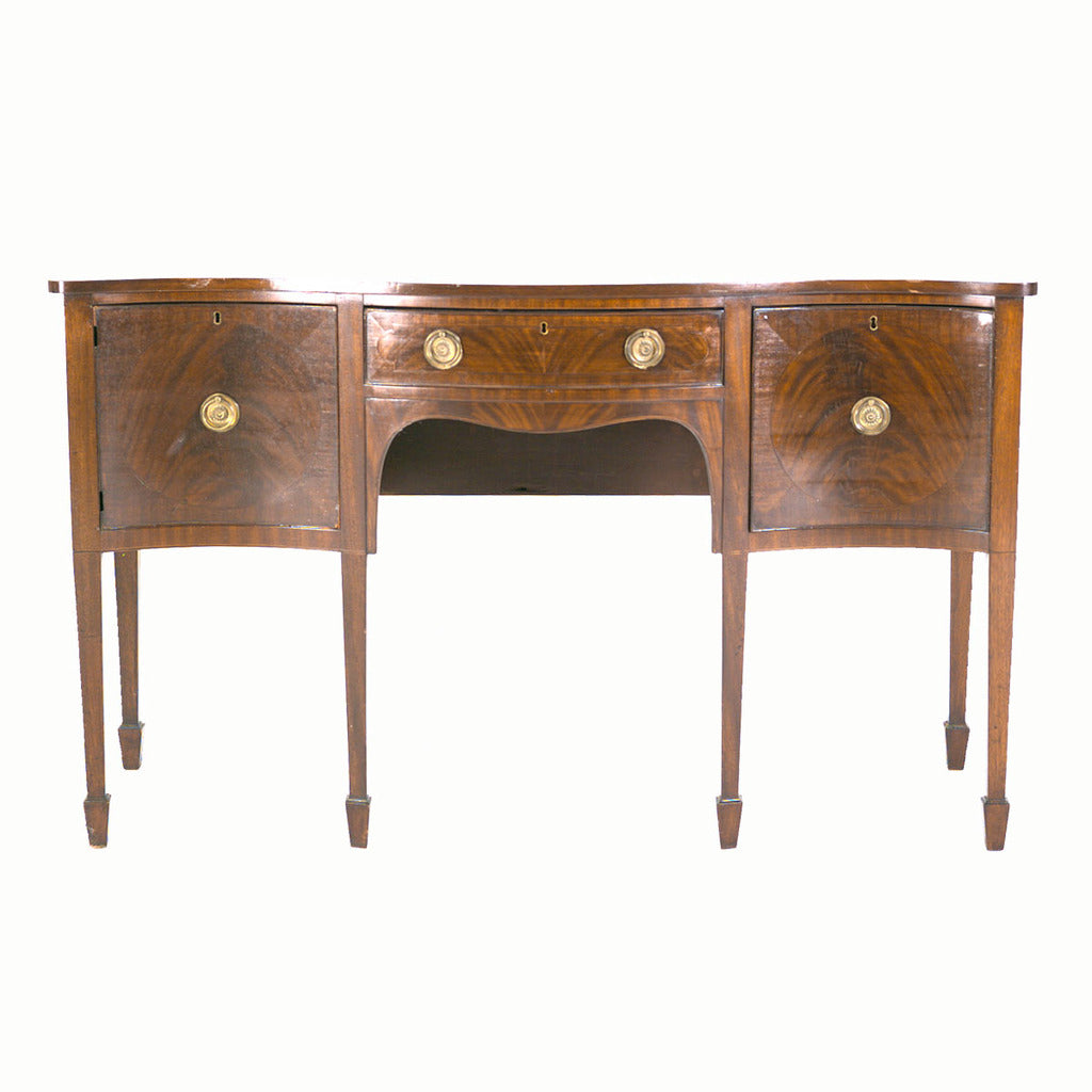 An English Sheraton period sideboard with serpentine shaped front. view 2