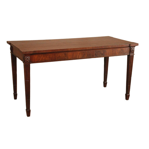 A mahogany serving table standing on tapering, stop-fluted legs. View 1