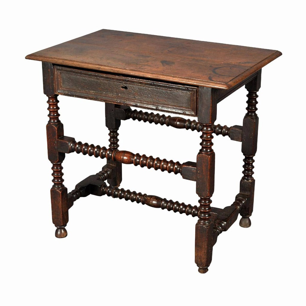 A 17th century English Charles II period oak side table. view 1