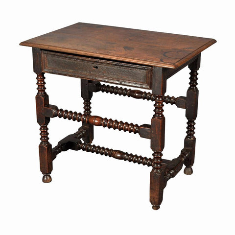 A 17th century English Charles II period oak side table. view 1