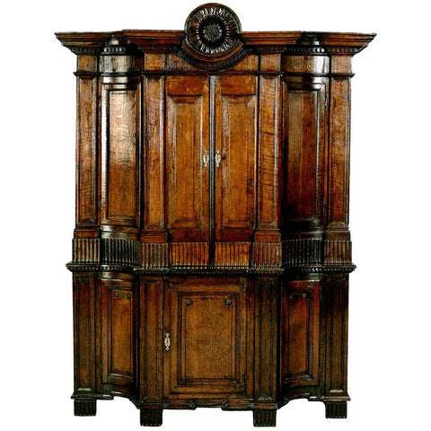 Exceptional oak cabinet with concave-shaped side sections and carved sunflower. view 1