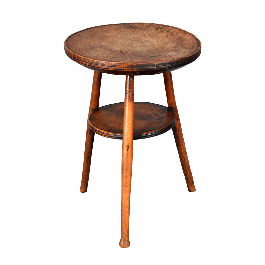 The 2.25 inch thick top is lathe-turned to have a dished rim and incised lines around the edge. view 1