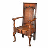 An antique oak wainscot chair with shaped and fielded panel back. view 1