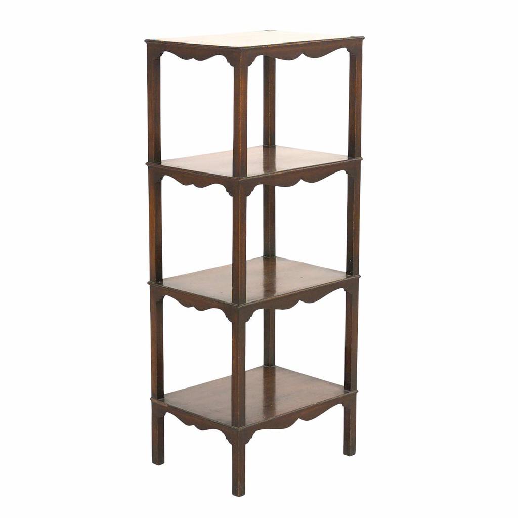 A 19th century English mahogany four tier whatnot with shaped friezes. view 1