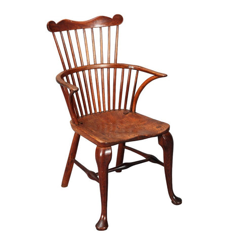 A 19th century comb-back Windsor armchair with cabriole front legs. view 1