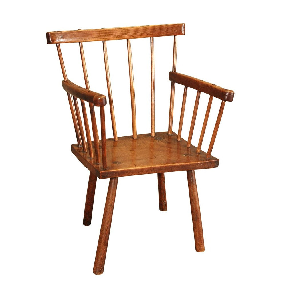 A  19th century simple Windsor chair in ash with a sycamore seat. view 1