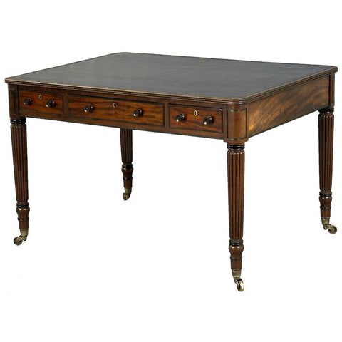 A 19th century Regency mahogany reeded leg writing table with ebony beading. view 1